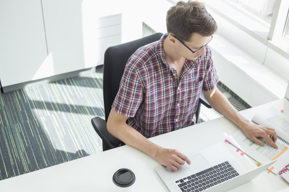 linkfool - creative businessman working at desk in office